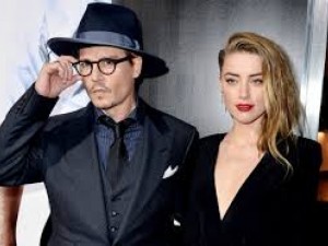 Бившата на Джони Деп гасяла цигари в лицето му
 